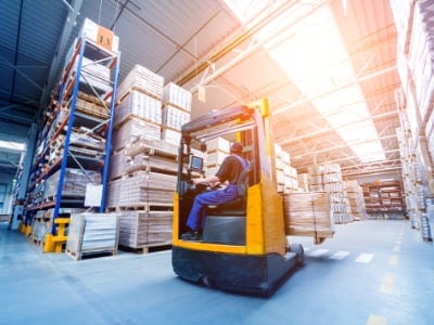 Forklift loader in storage warehouse ship yard. Distribution products. Delivery. Logistics. Transportation. Business background. Manufacturing and Warehouse Cleaning Service Cambridge