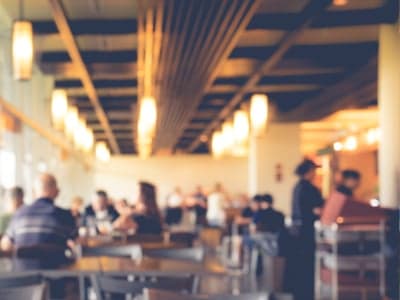 Blur people in cafe,restaurant with light abstract bokeh background. Retail and leisure cleaning service Cambridge