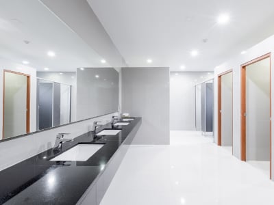 Cambridge office cleaning company. Public Interior of bathroom with sink basin faucet lined up Modern design. Janitorial services Cambridge. Cleaning services Cambridge